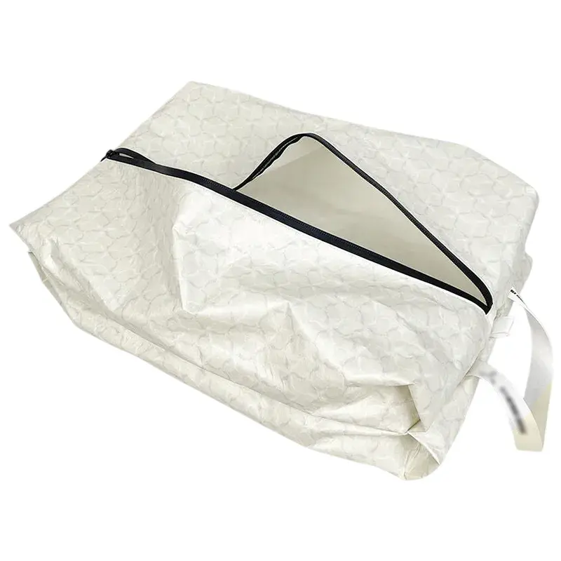 Tyvek skopose med lynlåslukning og håndtag, vist delvist åben